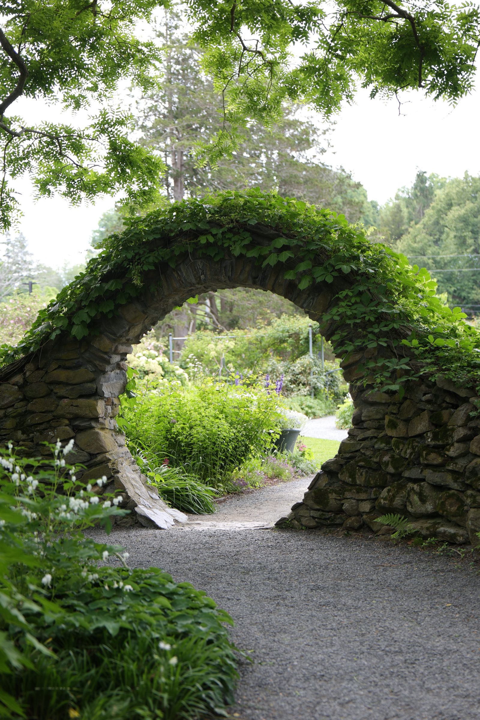 Stone moon-gate arch over a garden path